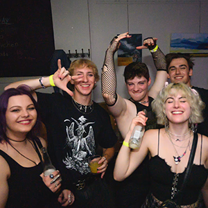 Picture of happy emo people drinking.